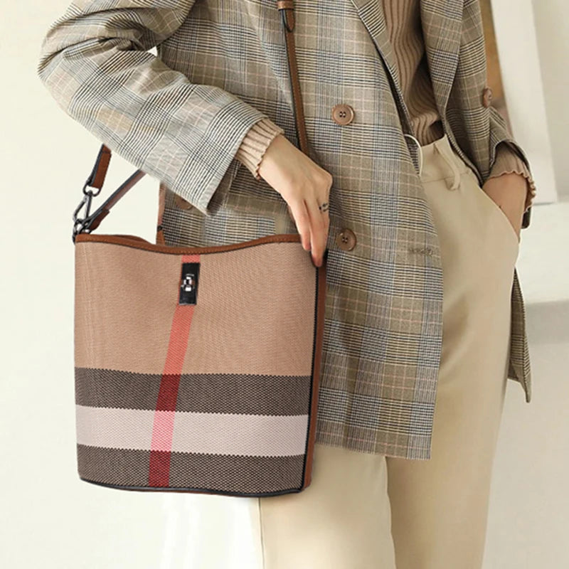 The classic women's one shoulder crossbody bag is a large capacity portable checkered bag made of high-quality canvas and cowhid