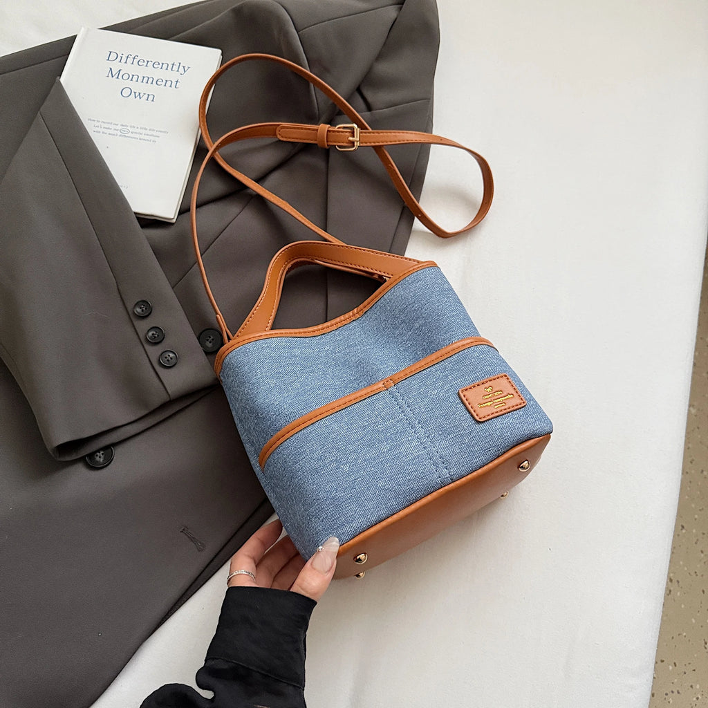 Women handbags. Early autumn senior commuter niche mobile phone slung bag girl 2025 new retro brown bucket bag small handbag