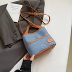 Women handbags. Early autumn senior commuter niche mobile phone slung bag girl 2025 new retro brown bucket bag small handbag